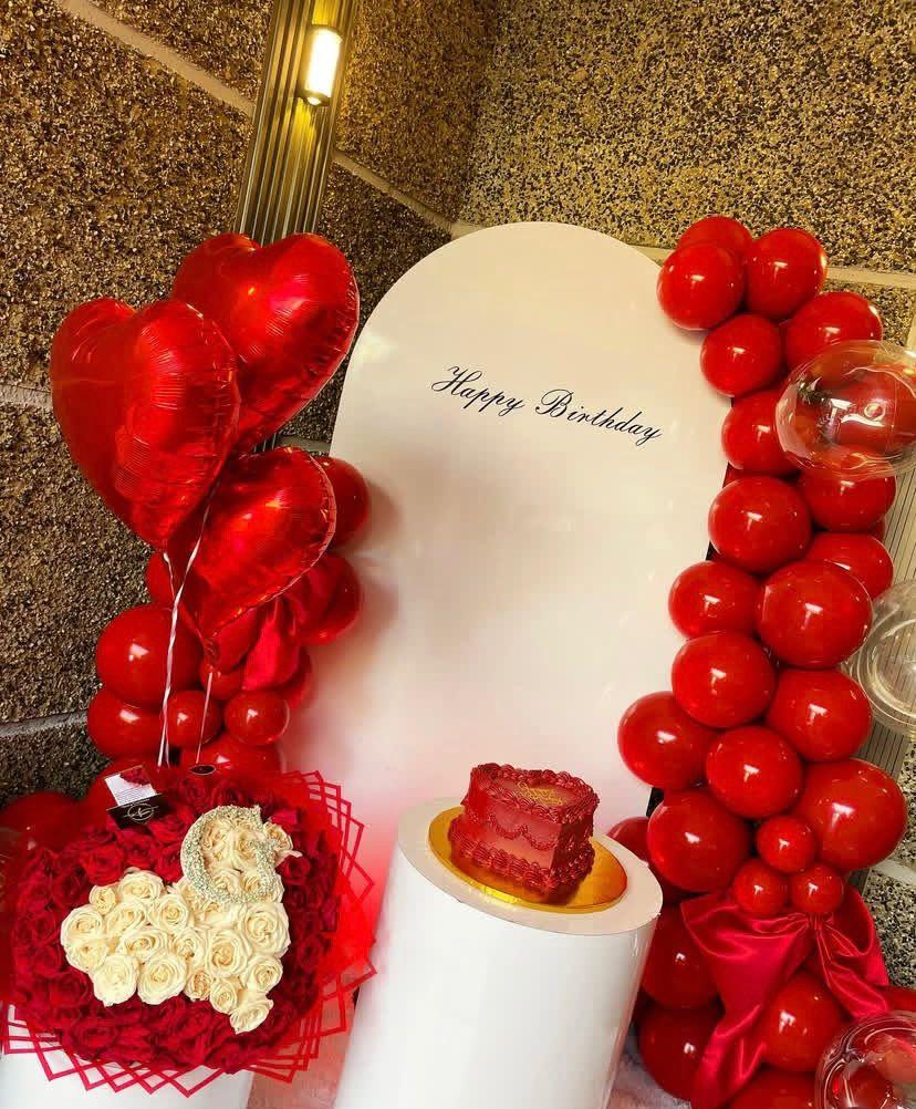 Luxury romantic anniversary hotel room setup with roses balloons and candles Abuja Nigeria FOA_gifts